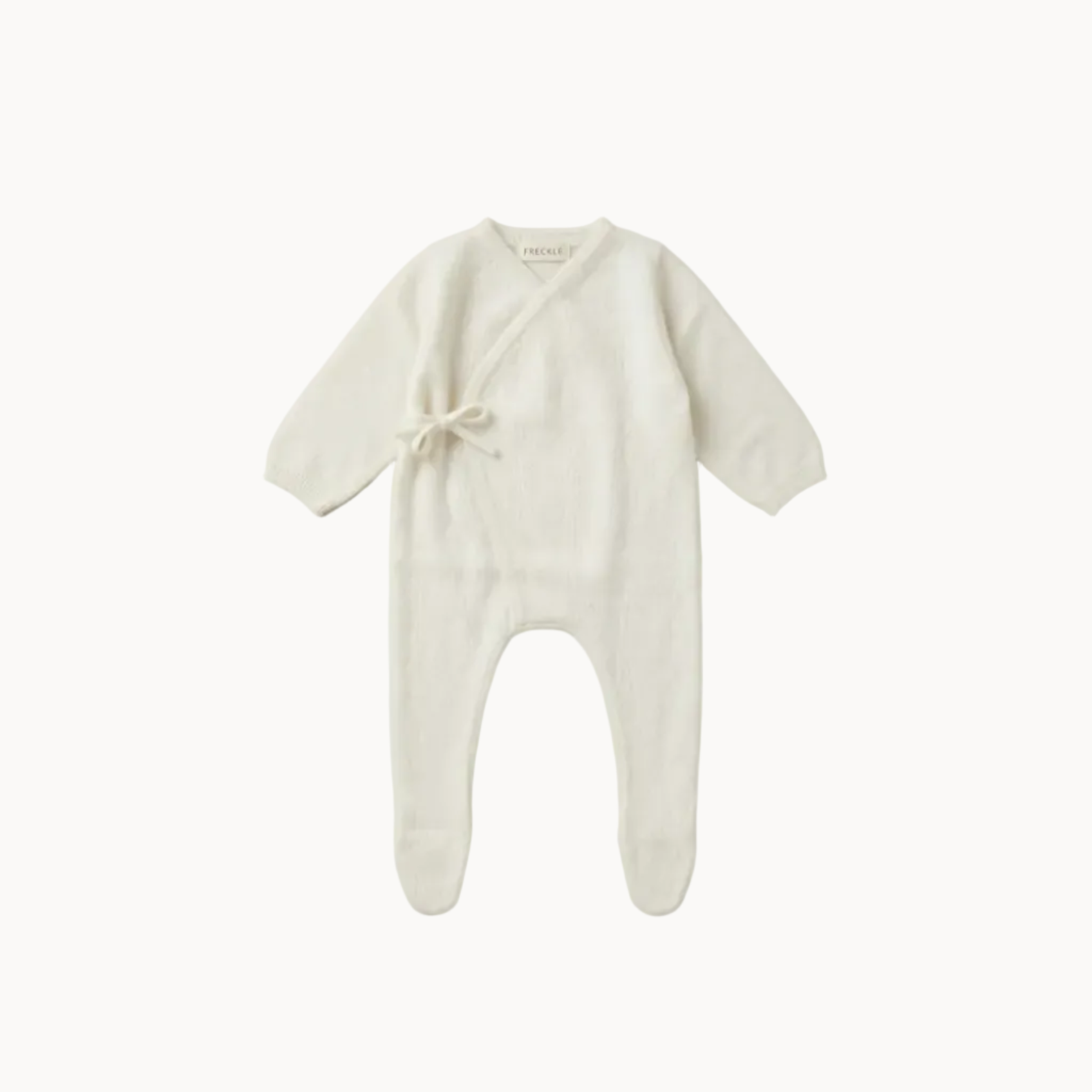 White baby onesie on a white background