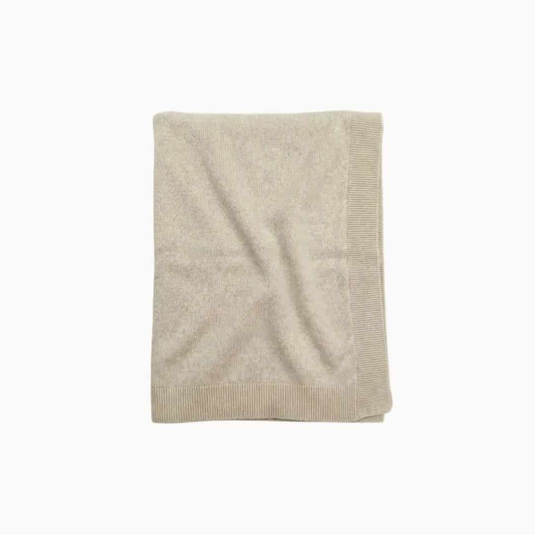 Beige blanket on a white background