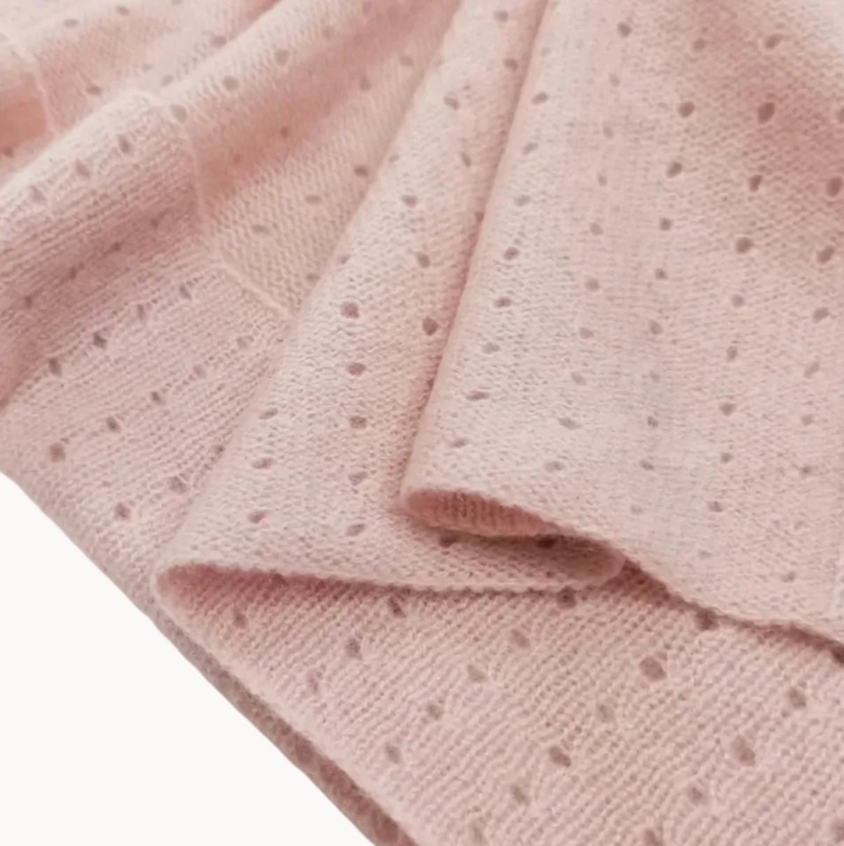 Pink textured fabric on a white background