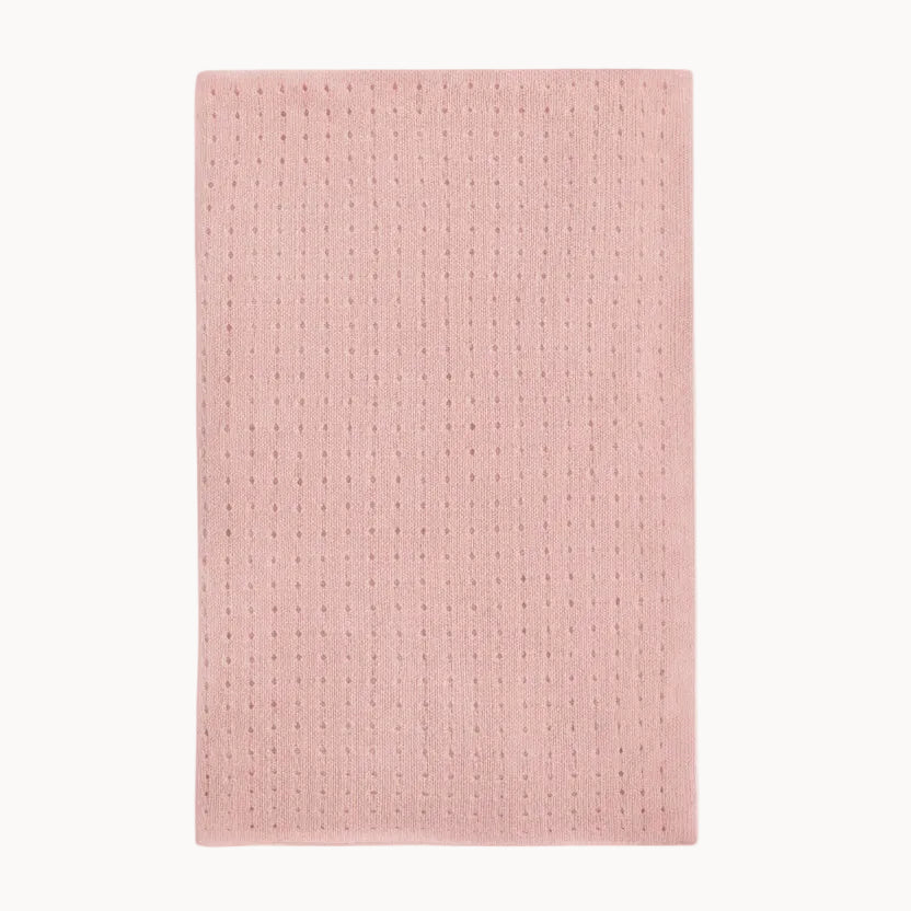Pink cashmere pointelle baby blanket on a white background
